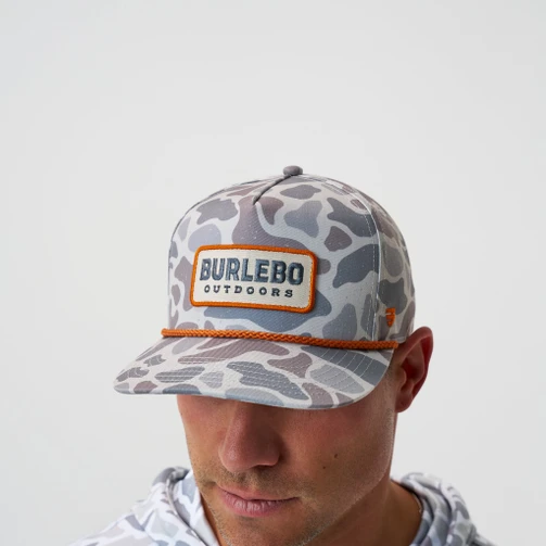 Man wearing the Burlebo hunting season cap in classic deer camo