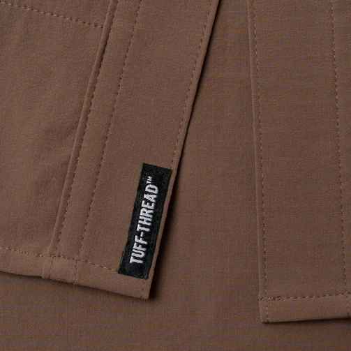 Close-up of the Tuff-Thread label on the hem of The Lewis Poncho Western Tuff-Thread shirt