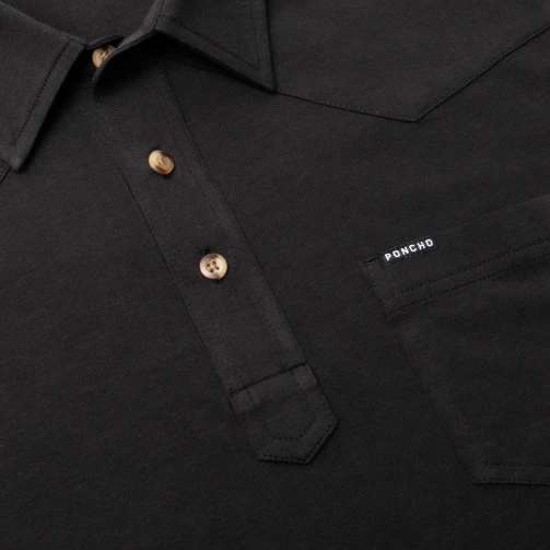 Close-up of the button placket and Poncho logo on The Permian black Field Polo