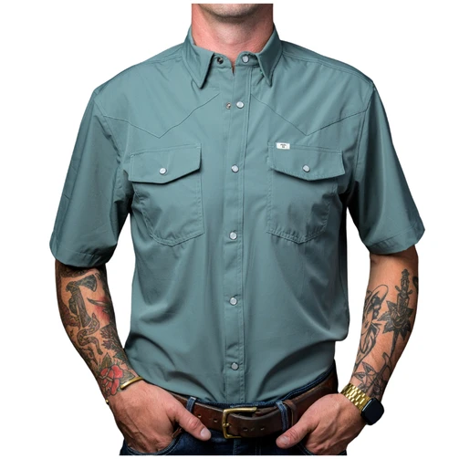 Man wearing the Ferrell CORE men's short sleeve pearl snap shirt in Aqua, front view