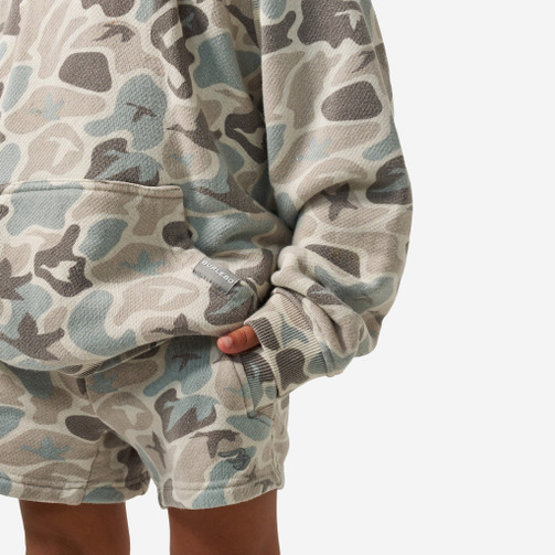 Kangaroo pocket on the Burlebo youth vintage washed hoodie in mallard mayhem camo