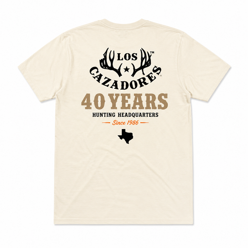 Back view of the Los Cazadores 40 Years Short Sleeve Tee in cream featuring the 40 Years Hunting Headquarters graphic on a white background.