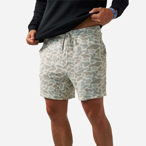 Burlebo vintage washed shorts in classic deer camo, front view on model