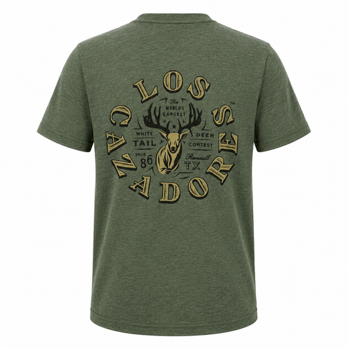 Back view of Los Cazadores heather olive green short sleeve t-shirt displayed on a ghost mannequin against a white background. Features a large vintage-style Los Cazadores deer contest graphic centered on the back with antlers, deer illustration, and heritage-inspired typography in tan and black tones.