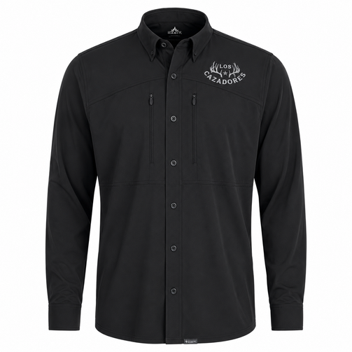 Front view of a Los Cazadores men's long-sleeve performance button-up shirt displayed on an invisible ghost mannequin against a white background. The black technical shirt features a structured button-down collar, full button-front closure, dual vertical zippered chest pockets, and lightweight performance fabric. A white Los Cazadores antler logo is embroidered on the wearer's left chest. The shirt is presented in a high-resolution ecommerce-style product image highlighting its outdoor functionality, clean tailoring, and hunting lifestyle branding.