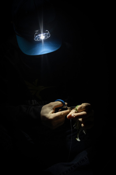 Person using the Cyclops Force XP headlamp white light in the dark