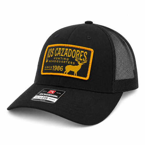 Angled front view of Los Cazadore Hunting Headquarter Patch Richardson 112 Cap in Black with Black Meshing on white background.