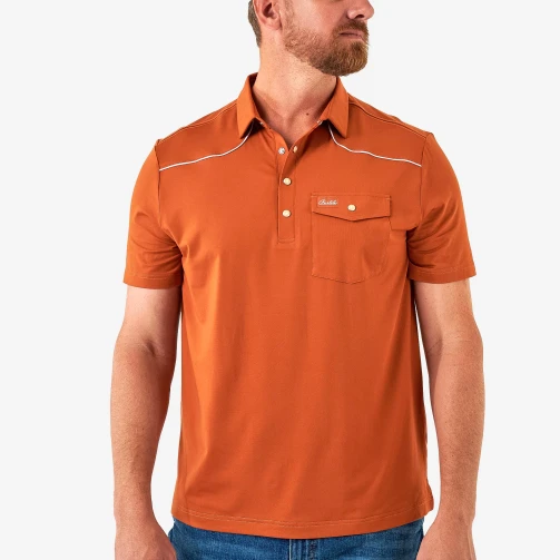 Burlebo Pearl Snap Performance Polo in Orange, front view showing the pearl snap closure and logo flap chest pocket.