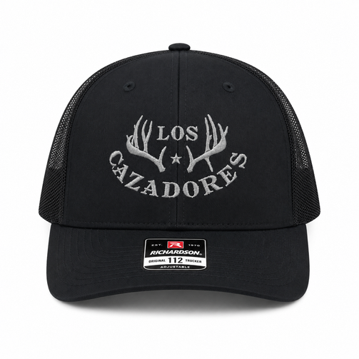 whitebox image of front view of los cazadores logo embroidered cap in black and black mesh backing