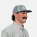 Side profile of a man wearing the Turtlebox all mesh blue cap with navy brim
