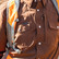Worker wearing a safety vest and harness over The Lewis brown Poncho Western Tuff-Thread long sleeve shirt