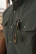 Close-up of a Ferrell CORE short sleeve pearl snap shirt with sunglasses tucked into the chest pocket's sunglasses slit