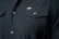 Ferrell CORE men's grey short sleeve western snap shirt with pearl snaps and chest pockets, close up view of front chest pockets