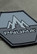 Close-up of the rubber Pnuma hex patch on the Alpha Vertex Jacket
