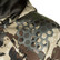 Close-up of the hex-pattern shoulder overlay on the Pnuma Waypoint Jacket