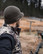 Hunter wearing the Pnuma Merino Wool Visor Beanie in a field