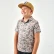 Boy wearing the Burlebo youth performance polo in classic deer camo and a tan cap