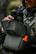 Hunter pulling binoculars from the Pnuma Bino + Tech Harness