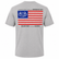 Back view of a Los Cazadores adult short-sleeve t-shirt displayed on an invisible ghost mannequin against a white background. The light gray crew neck tee features a large patriotic American flag graphic centered on the upper back with a blue canton containing the Los Cazadores antler logo, distressed red and white stripes, and the phrase “Unapologetically American” above the flag. Below the graphic, the shirt displays the text “Hunter to the Core.” Clean ecommerce-style product image showcasing the full back design and classic fit.