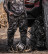 Hunters in Pnuma Highpoint Caza OV camo standing by a truck with a bow and antlers