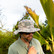 Man in sunglasses wearing the Burlebo bucket hat in classic deer camo outdoors