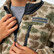 Close-up of the zipper and Burlebo patch on the Burlebo youth mountain fleece sherpa jacket in alpine camo