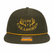 Front view of a loden green Los Cazadores rope hat with gold embroidered logo and gold rope detail on white.