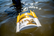Frabill Flow-Troll Bait Bucket floating in water while in use to keep bait alive