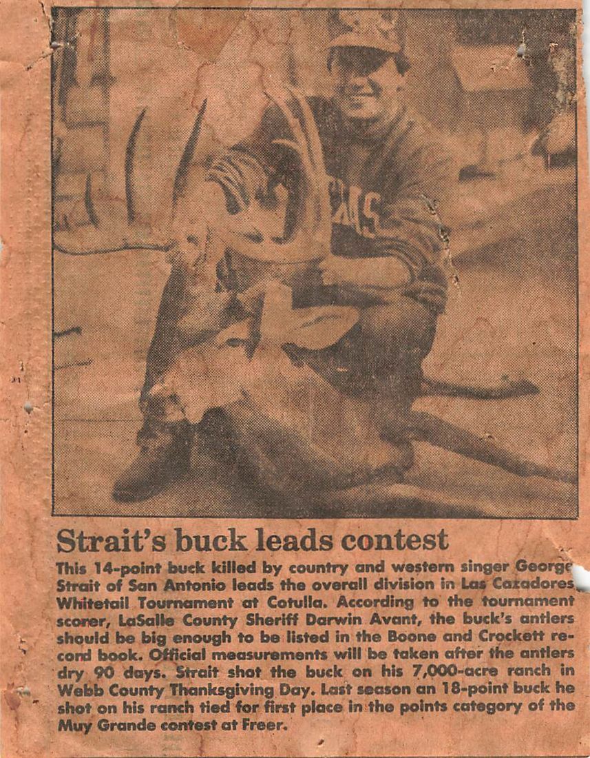 Newspaper clipping headlined Strait's buck leads contest, with a photo of George Strait and his buck