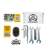 All contents of Strider Tool Kit presented including six wrenches, stickers,  and cards.