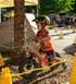 Young rider navigating a biking course while riding their orange 12 Sport balance bike with upgraded Strider Carbon Fiber Wheels