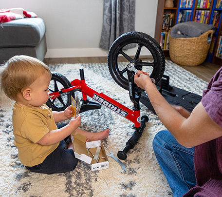 Child on balance bike
