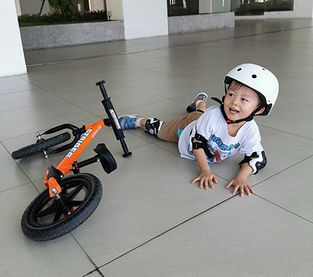 Child on balance bike