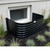 Gloss black powder coated window well installed at a basement window