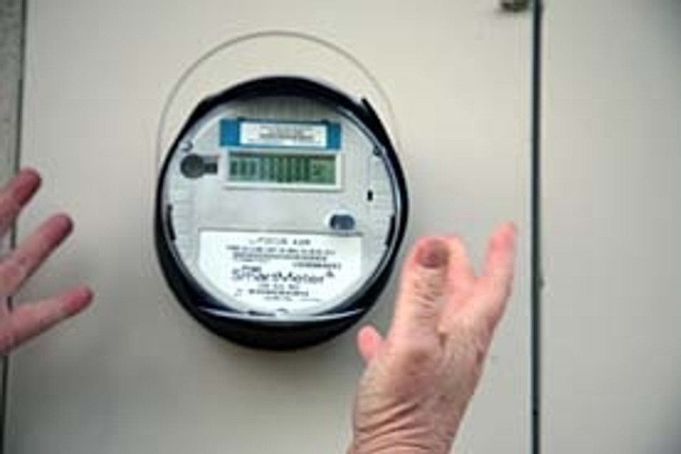 Slide one of the two Tachyon Silica disk products under the EverStay band on top of the Smart Meter. Make sure the text, “Energy flows out this side”, is facing the center of the Smart Meter. Tachyon products like these disks transform negative effects from RF Radiation into positive.