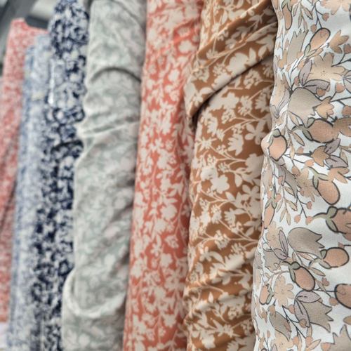 Beth's Exclusive Peach And Apricot Flowers Lightweight Pine Skin Fabric (sold by half yards)