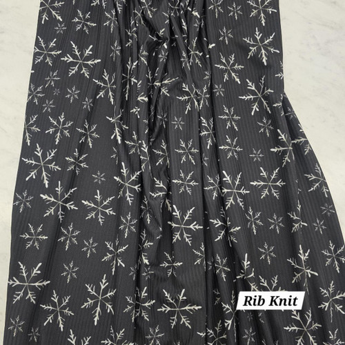 Beth's Exclusive Snowflakes on Black Poly Rib Knit Fabric (sold by half yards)