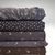 Beth's Exclusive Scattered Flowers on Charcoal 4 Way Stretch Crinkle Poly (sold by half yard)
