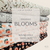 Beth's Exclusive Orange Blooms on White Speckled Poly Swiss Dot Circles (sold by half yards)