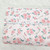Roses on Light Pink Knit Swiss Dot Fabric (sold by half yards)