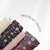 Wildflower Floral (Chocolate Wine) Knit Swiss Dot Fabric (sold by half yards)