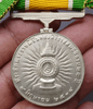 Medallion decorated with ribbon, King Rama IX, commemorating the 25th anniversary of the accession to the throne, 1971, silver (female model)