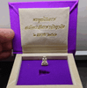 Phra Phuttha Nirantarai amulet, made of silver, commemorating Her Royal Highness Princess Maha Chakri Sirindhorn's birthday on Thai Heritage Conservation Day, Wat Ratchabophit (13 mm high), with original box, B.E. 2541 (1998).