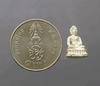 Phra Phuttha Nirantarai amulet, made of silver, commemorating Her Royal Highness Princess Maha Chakri Sirindhorn's birthday on Thai Heritage Conservation Day, Wat Ratchabophit (13 mm high), with original box, B.E. 2541 (1998).