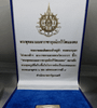 The Phra Phuttha Nawamaharajayuchchabpariwatnamongkol amulet, with the royal monogram "B.P.R." on the reverse, is made of silver and commemorates the 72nd birthday of King Rama IX in 2542 BE (1999 CE). Comes with the original box.