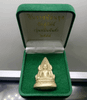 A replica of the Phra Phuttha Chinnarat amulet, "Ten Thousand Yantra" series, free-standing, with a bell inside, made of silver, large size, 4.5 cm tall, from Wat Suthat, B.E. 2548 (2005). Comes with the original box.