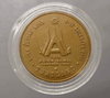 Bronze medal with black patina, depicting His Majesty the King sailing a Micro Moth, 13th Asian Games, 1998.