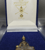 The Phra Kring Phuttha Mahabarami Anupap Phisut Anuttara Sangkham Vichai amulet, in satin copper, is a work by National Artist Ajarn Chakraphan Prosayakrit, created in 2010-2011. It comes with its original box and is rare.