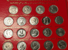 A complete set of 22 uncirculated 1-baht commemorative coins and a 1-baht banknote (King Rama IX), packaged in a red blister pack.