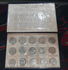 A complete set of 15 1-baht coin albums, green leather cover, from the Royal Thai Mint. Uncirculated (limited production).